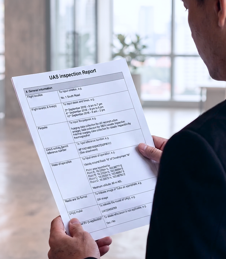 A man holding a sample report